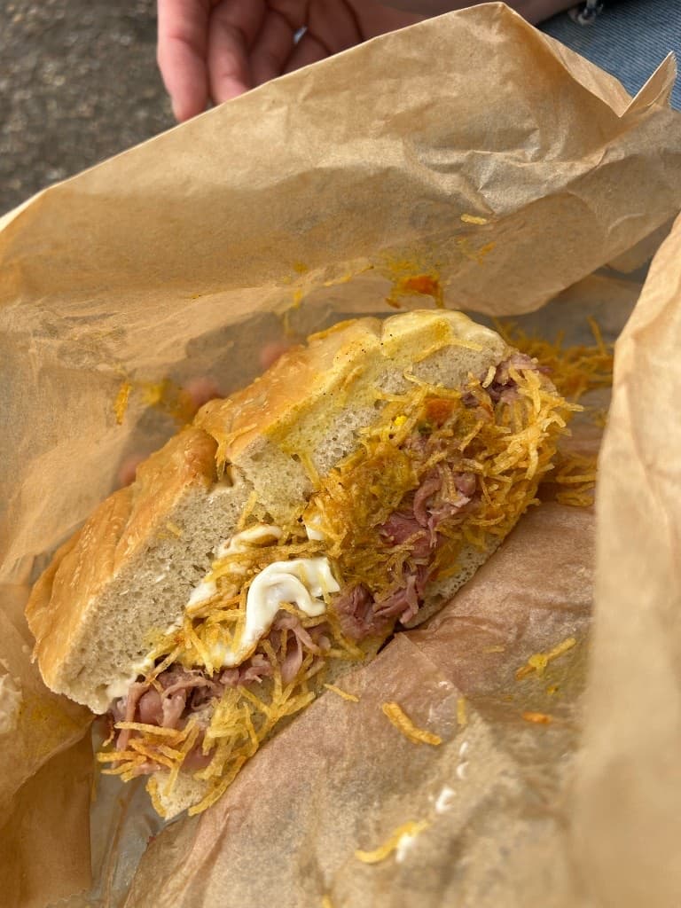 The Ham, Egg ’n’ Chips, spilling shoestring fries into the paper bag