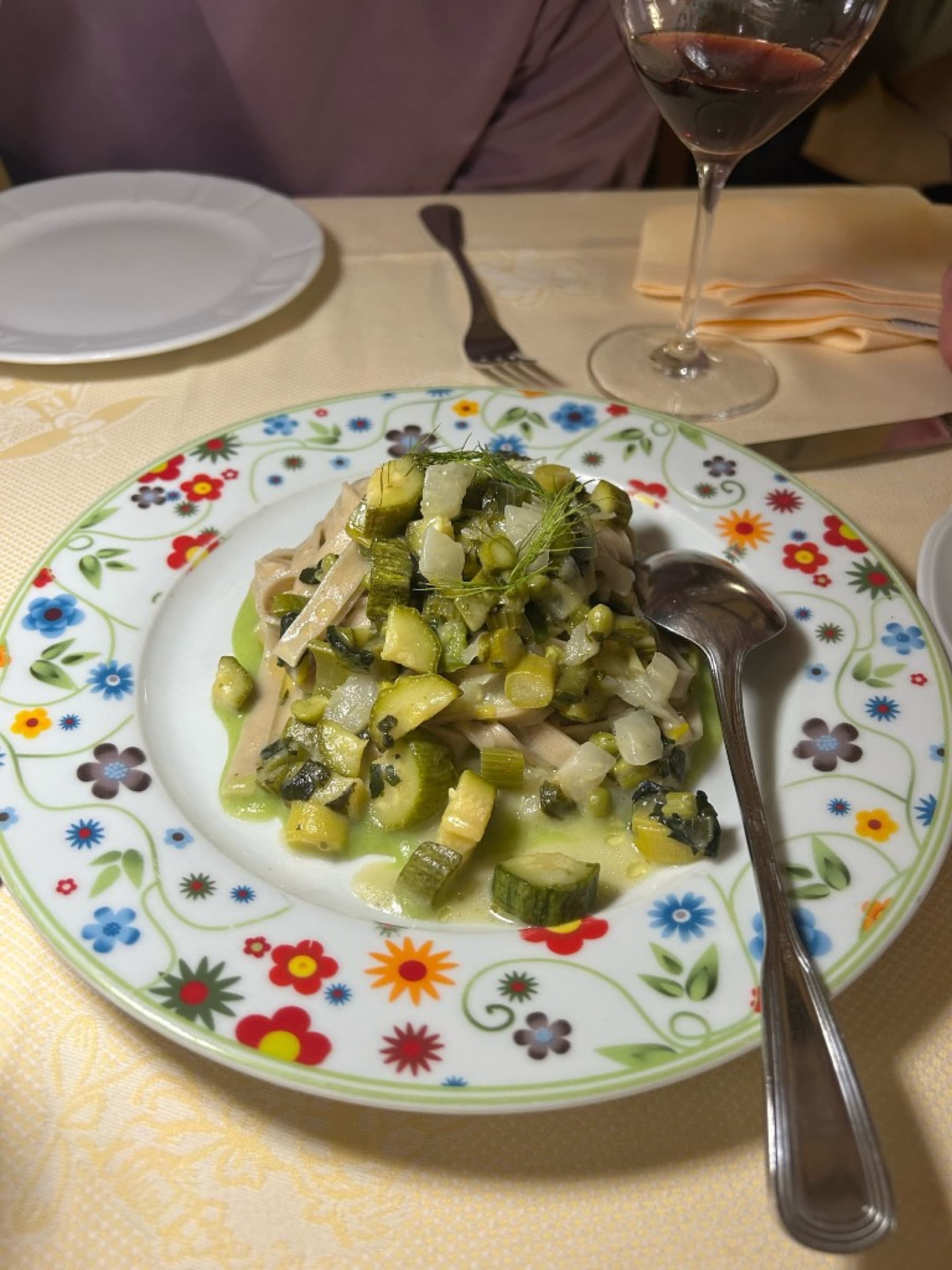 Wide pasta with zucchini and a green herb sauce